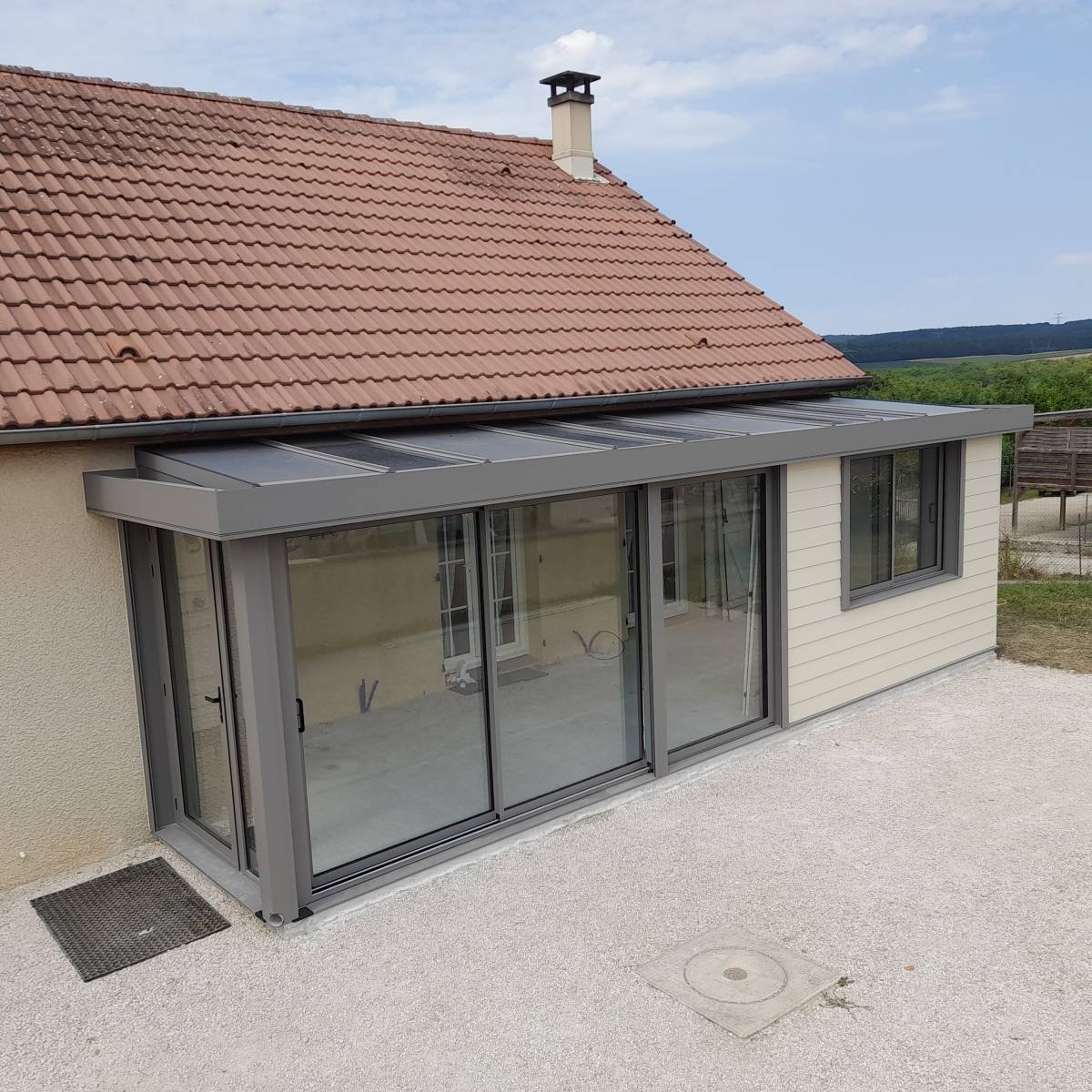 Entreprise d’installation de vérandas sur-mesure en aluminium pour extension d’une maison à Curley