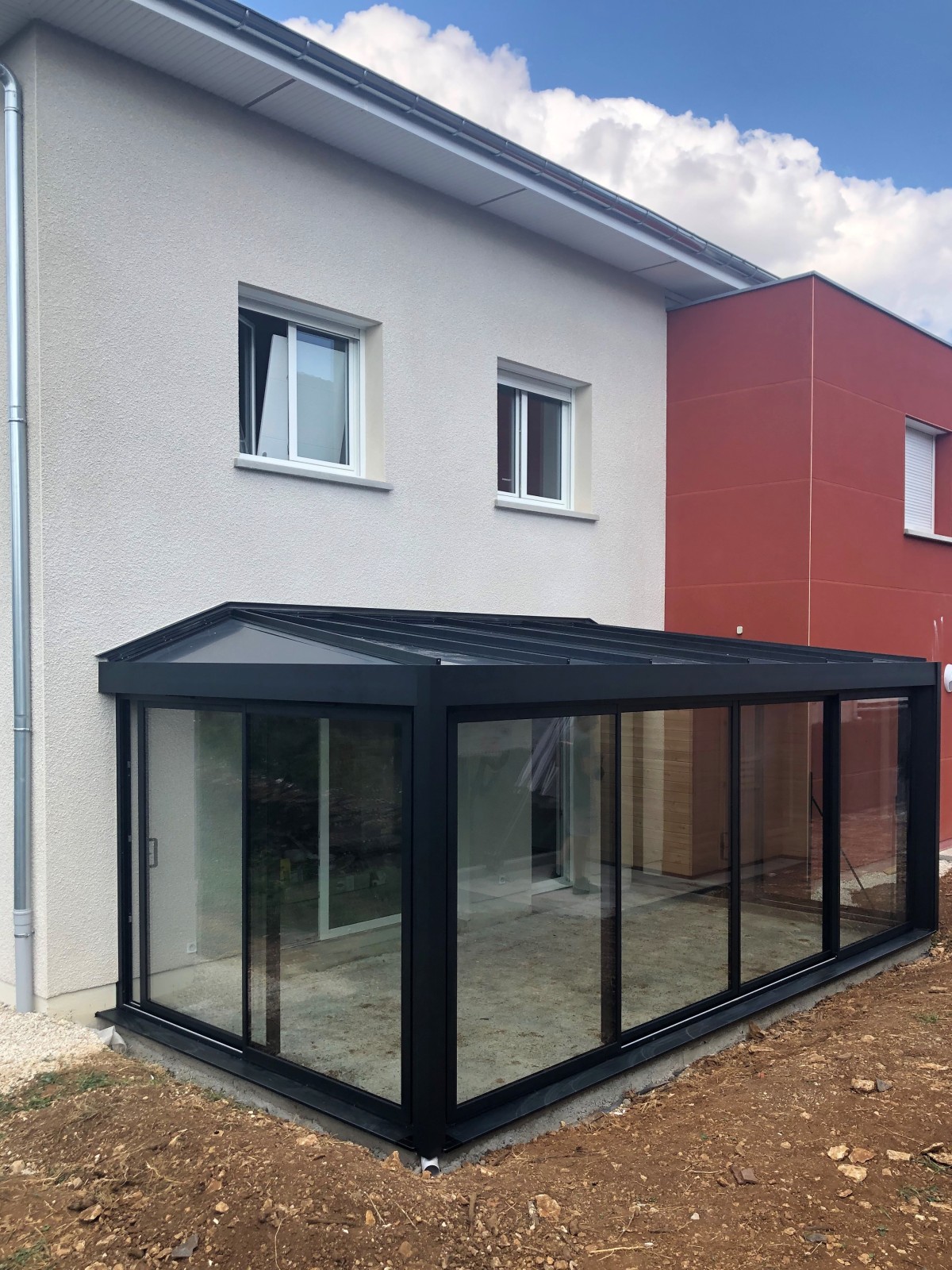 Extension de maison avec une véranda en aluminium à Savigny-le-Sec, proche de Dijon, en Côte d'Or.